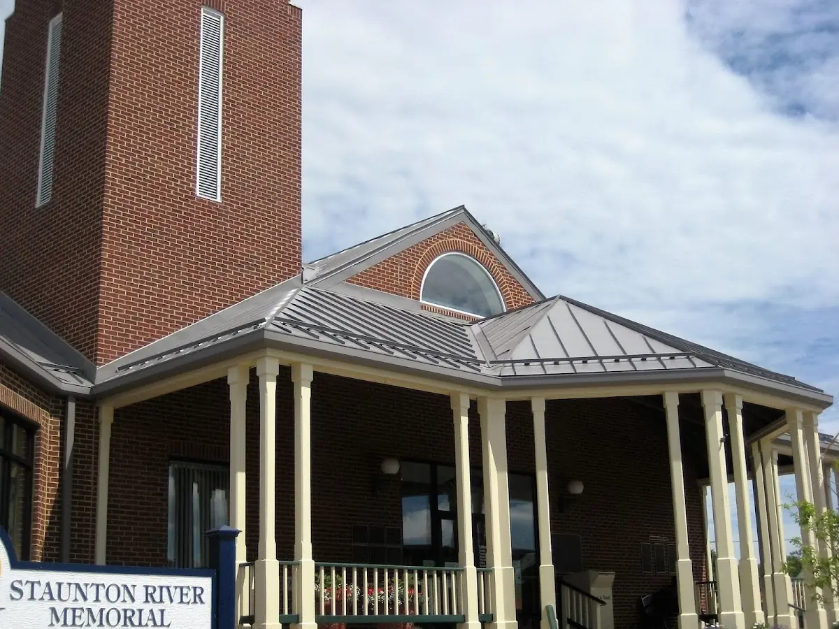Skilled roofing craftsmen working on a residential roof in Downtown Fayetteville